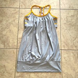 Lululemon size 6 top in gray with orange trim.